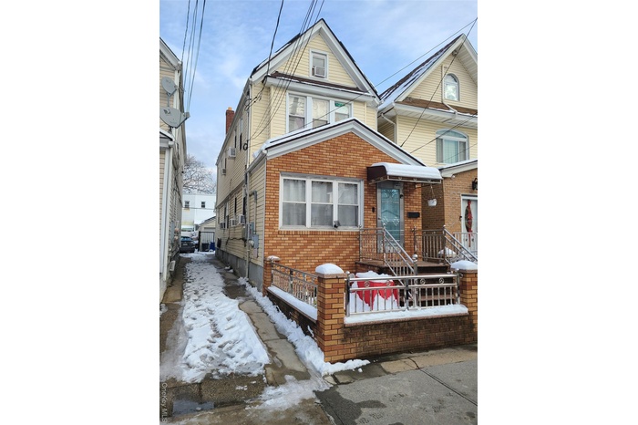 View of front facade featuring brick siding