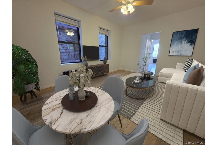 Dining area featuring a ceiling fan and wood finished floors