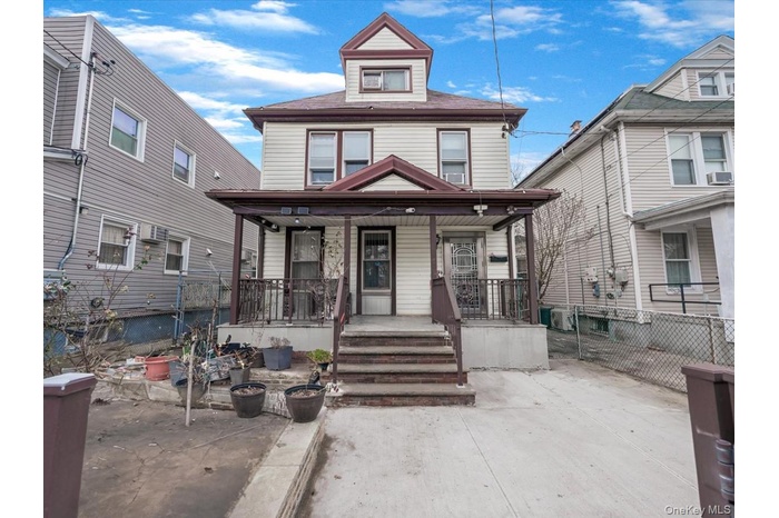 Traditional style home featuring covered porch