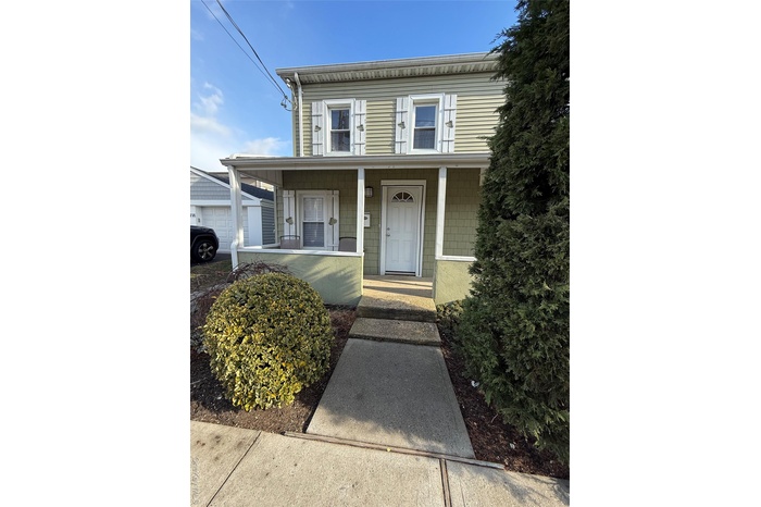 View of front facade featuring covered porch