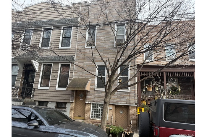 Traditional home featuring washer / clothes dryer and brick siding