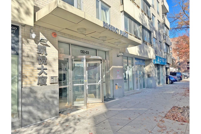 Doorway to property with brick siding