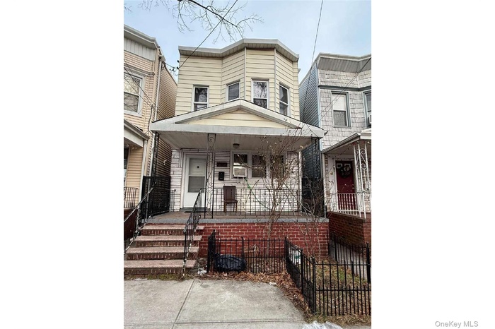 Traditional-style home with covered porch