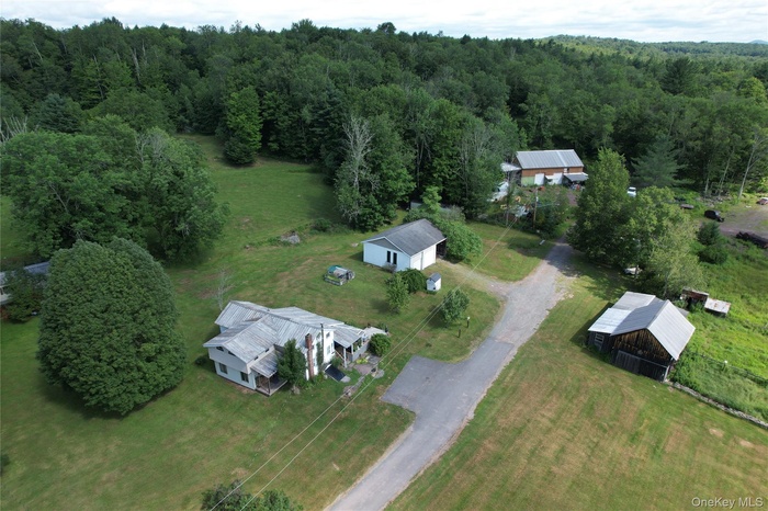 Aerial overview of property's location with a forest