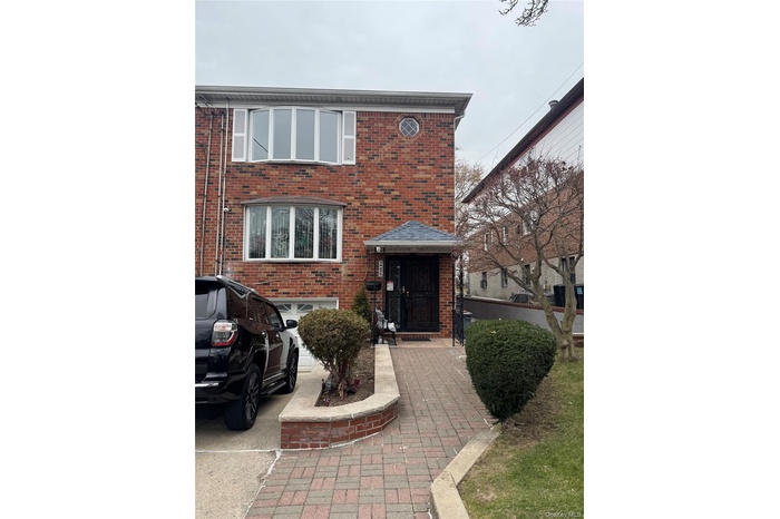 View of front of house featuring brick siding