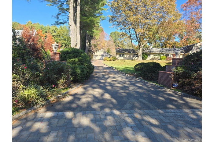 View of road featuring curbs and street lighting