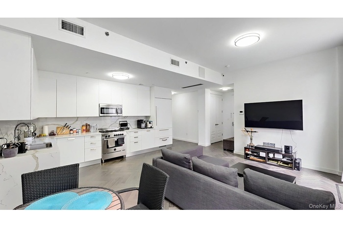 Living room featuring baseboards