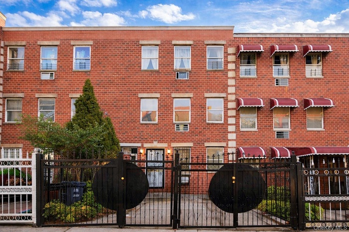 Welcome Home! apartment building with a fenced front yard