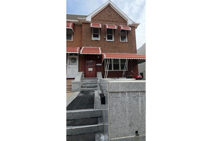 View of front of property featuring brick siding