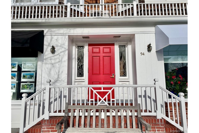 View of exterior entry featuring covered porch