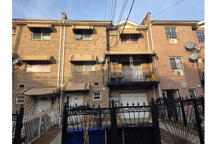 View of apartment building / complex with a fenced front yard