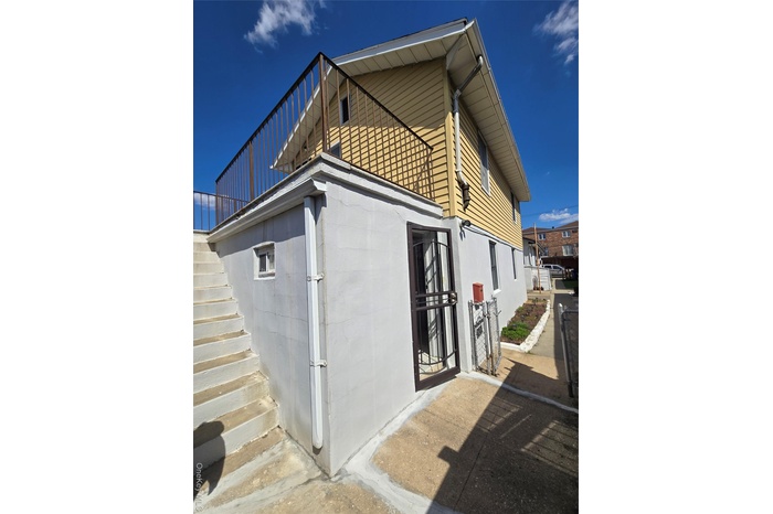 View of side of property with stairway
