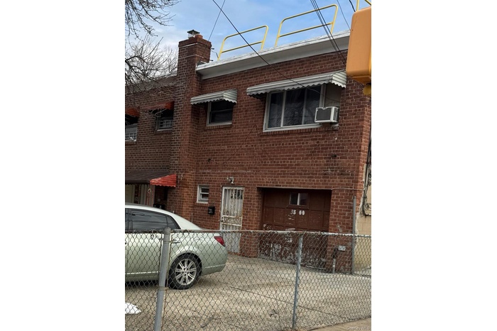 View of building exterior with cooling unit