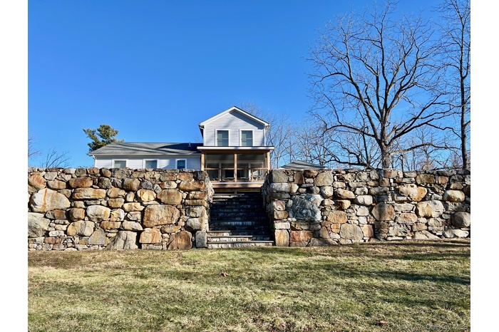 Charming house sited off the road with a great yard and wonderful views