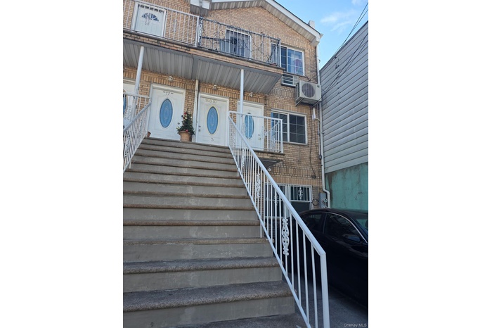 View of exterior entry with brick siding