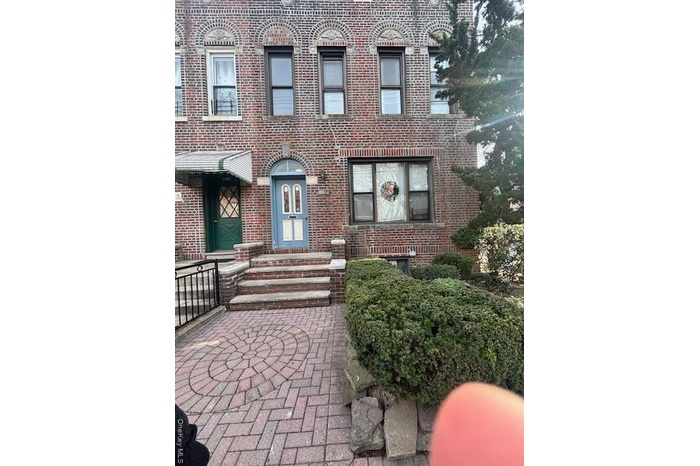 View of front of house featuring brick siding