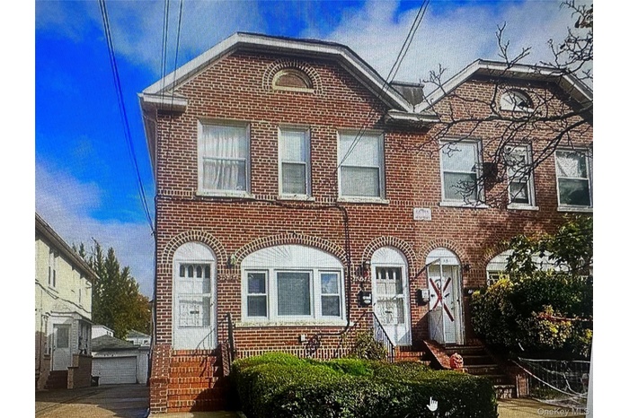 View of front of home featuring brick siding and entry steps