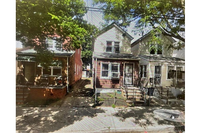 View of front of property with a fenced front yard