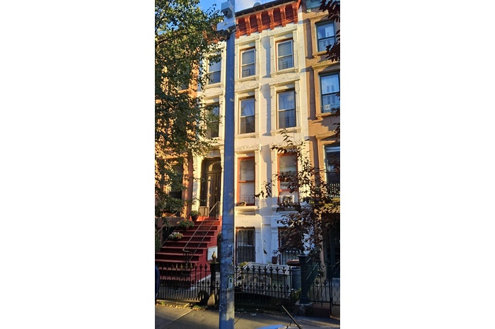 View of property with a fenced front yard
