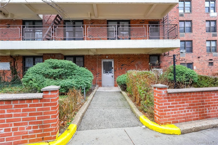 Doorway to property with brick siding
