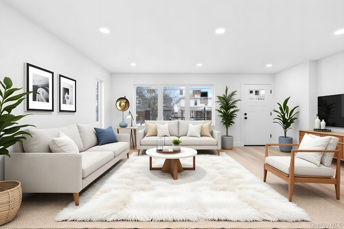 Living room with recessed lighting and wood finished floors