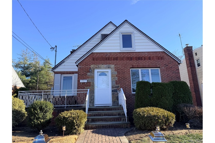 Bungalow-style house featuring brick siding