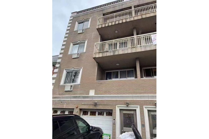 View of property featuring an attached garage