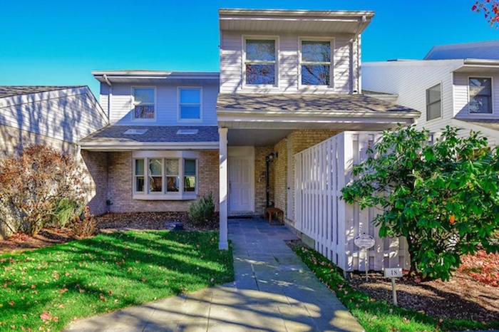View of front of property with a front lawn