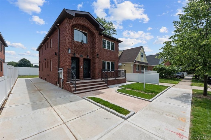 View of front of property featuring brick siding