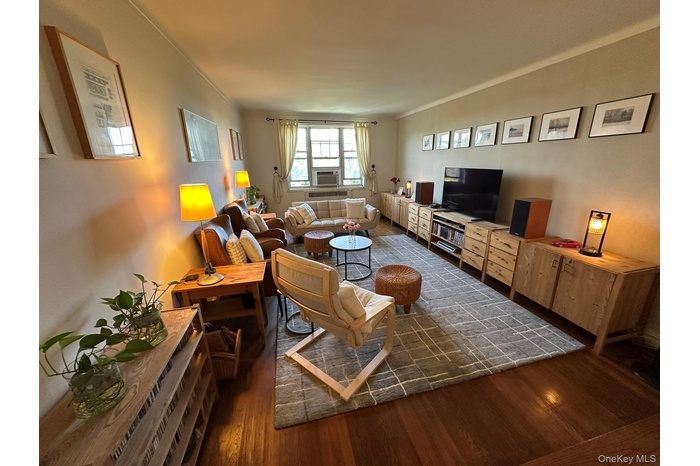 Sunken Living room featuring dark wood-style flooring