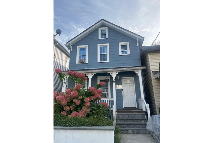 View of front of property with covered porch