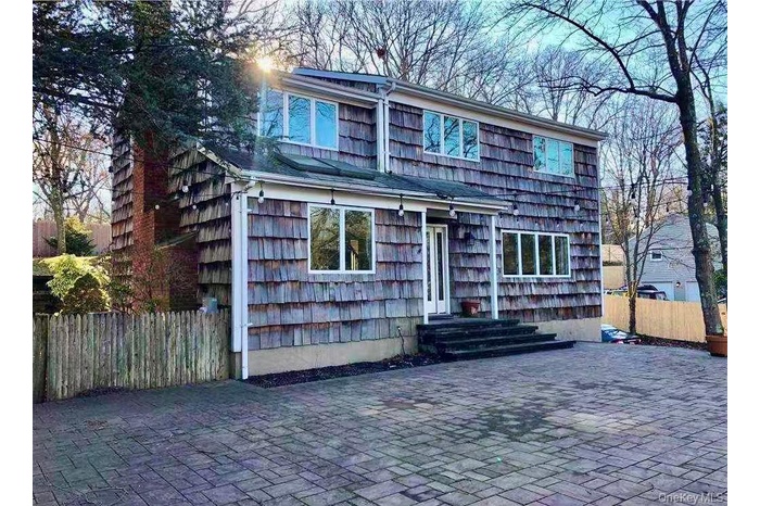 Traditional-style home featuring a patio area