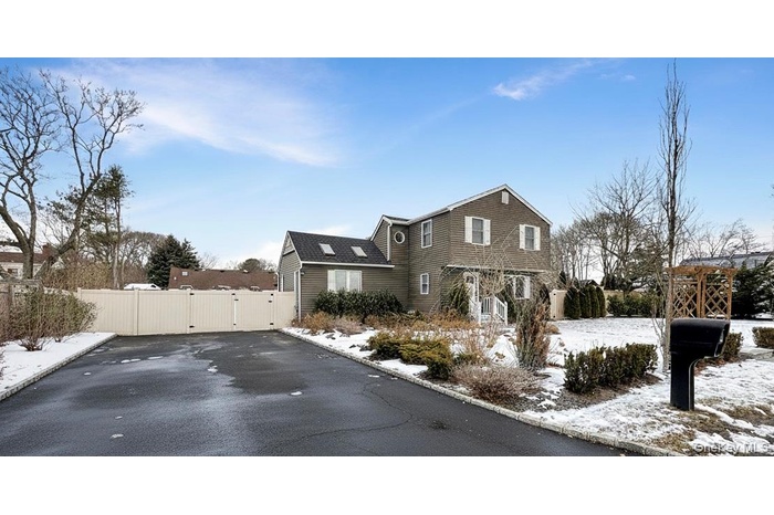 View of front facade featuring a gate