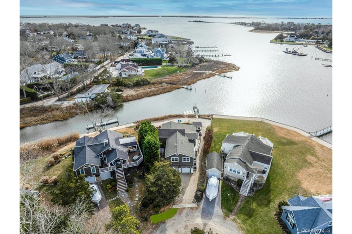 Aerial view of residential area featuring a large body of water