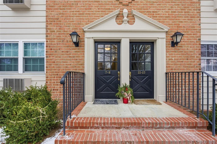 Property entrance with brick siding