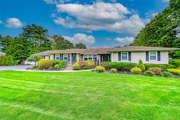 Ranch-style house featuring atrex front porch