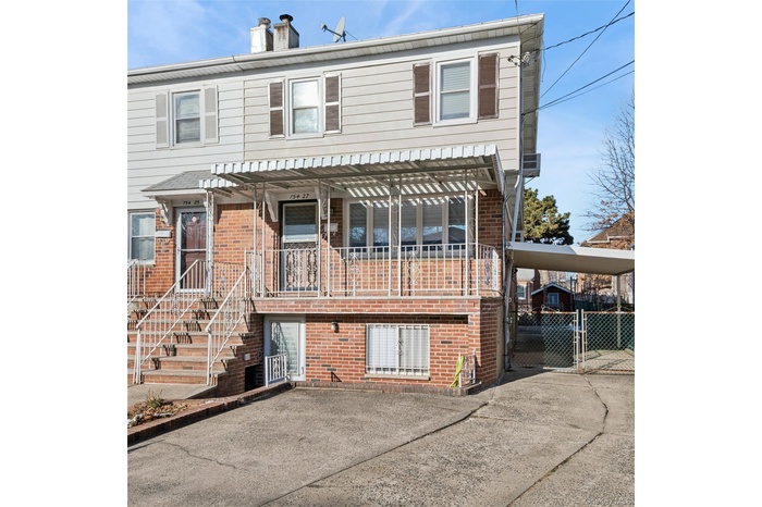 154-27 20th Rd offers brick & siding, an attached carport, and private 2 to 3 car driveway