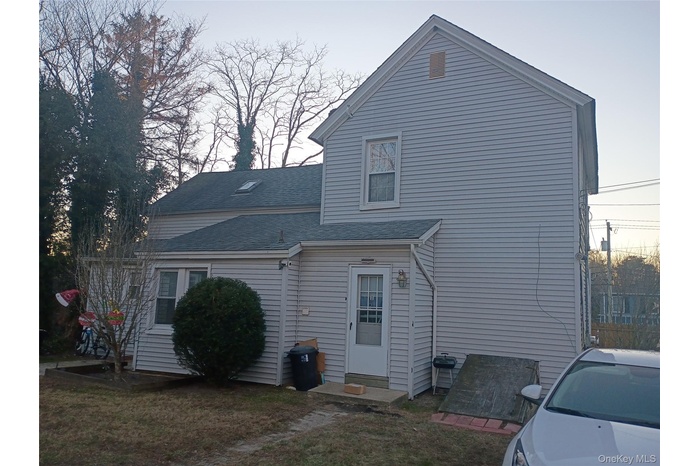 Rear view of home with rear entry to units # 1 & 2
