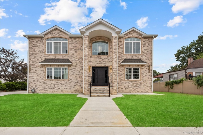 Traditional home with brick siding