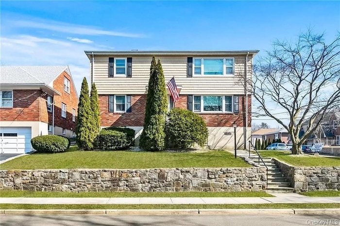 View of front facade featuring a garage