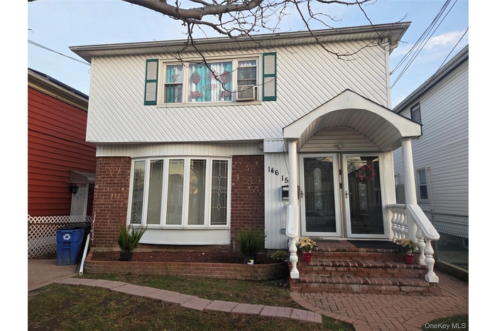 View of front of property with brick siding