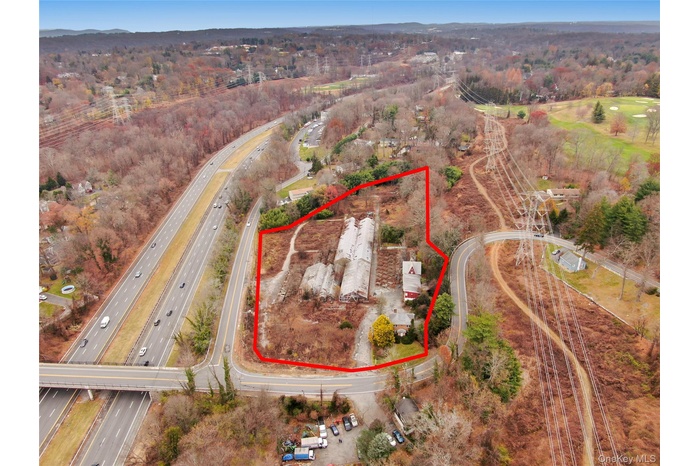 View of property location featuring property boundaries highlighted and a major roadway