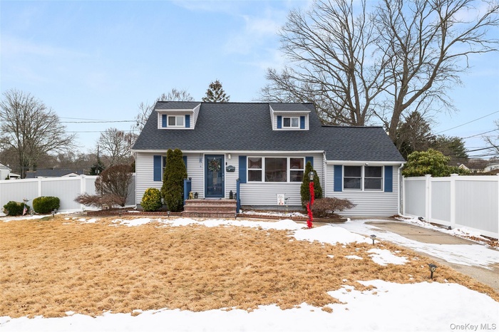 View of front of property featuring a shingled roof