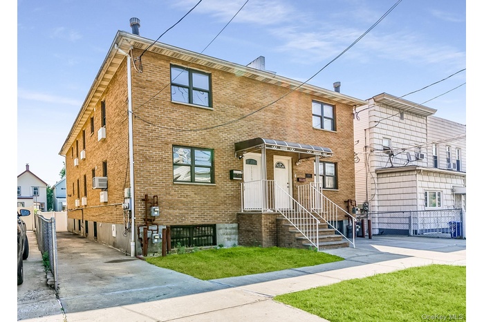 Traditional-style house with brick siding