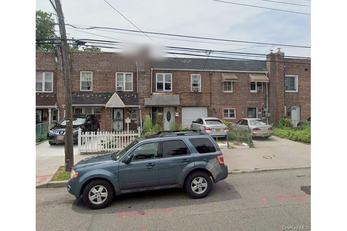 Traditional-style home with brick siding