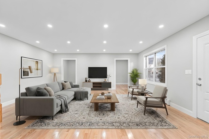 Living area featuring recessed lighting and light wood-style floors
