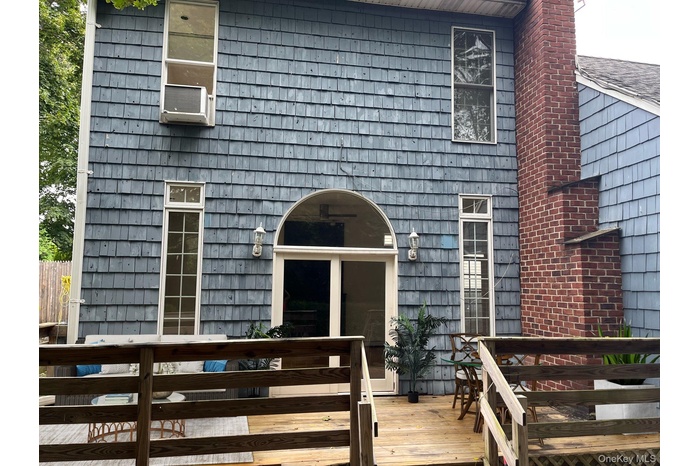Property entrance featuring a wooden deck