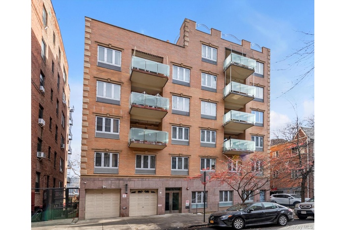 View of apartment building / complex with concrete driveway