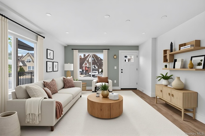 Living room featuring wood finished floors and recessed lighting