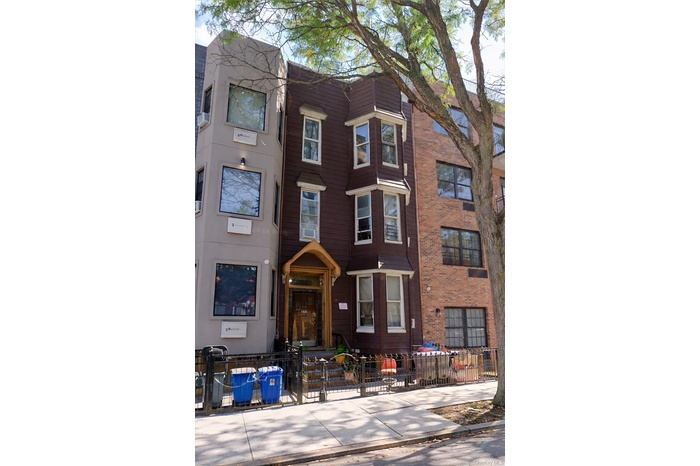 View of front of home with a fenced front yard